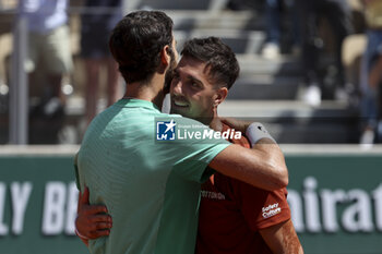 2023-06-02 - Karen Khachanov of Russia hugs Thanasi Kokkinakis of Australia after his victory during day 6 of the 2023 French Open, Roland-Garros 2023, second Grand Slam tennis tournament of the year, on June 2, 2023 at Stade Roland-Garros in Paris, France - TENNIS - ROLAND GARROS 2023 - WEEK 1 - INTERNATIONALS - TENNIS