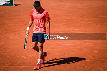 2023-06-04 - Novak DJOKOVIC of Serbia looks dejected during the eighth day of Roland-Garros 2023, Grand Slam tennis tournament, on June 04, 2023 at Roland-Garros stadium in Paris, France - TENNIS - ROLAND GARROS 2023 - WEEK 2 - INTERNATIONALS - TENNIS