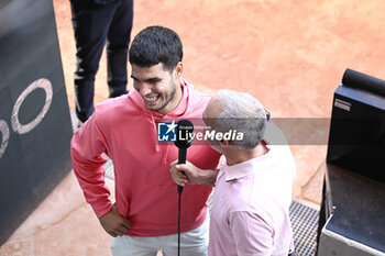 2023-06-04 - Carlos Alcaraz Garfia with Alex Corretja Verdegay during an interview during the French Open, Grand Slam tennis tournament on June 4, 2023 at Roland Garros stadium in Paris, France. Photo Victor Joly / DPPI - TENNIS - ROLAND GARROS 2023 - WEEK 1 - INTERNATIONALS - TENNIS