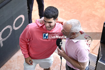 2023-06-04 - Carlos Alcaraz Garfia with Alex Corretja Verdegay during an interview during the French Open, Grand Slam tennis tournament on June 4, 2023 at Roland Garros stadium in Paris, France. Photo Victor Joly / DPPI - TENNIS - ROLAND GARROS 2023 - WEEK 1 - INTERNATIONALS - TENNIS