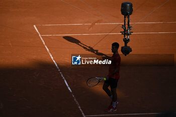 2023-06-06 - Novak Djokovic with a TV television spidercam (Spider cam camera) during the French Open, Grand Slam tennis tournament on June 6, 2023 at Roland Garros stadium in Paris, France. Photo Victor Joly / DPPI - TENNIS - ROLAND GARROS 2023 - WEEK 2 - INTERNATIONALS - TENNIS