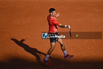 2023-06-06 - Novak Djokovic hits a forehand during the French Open, Grand Slam tennis tournament on June 6, 2023 at Roland Garros stadium in Paris, France. Photo Victor Joly / DPPI - TENNIS - ROLAND GARROS 2023 - WEEK 2 - INTERNATIONALS - TENNIS