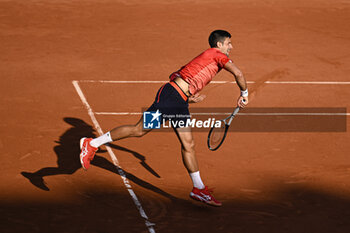 2023-06-06 - Novak Djokovic serves during the French Open, Grand Slam tennis tournament on June 6, 2023 at Roland Garros stadium in Paris, France. Photo Victor Joly / DPPI - TENNIS - ROLAND GARROS 2023 - WEEK 2 - INTERNATIONALS - TENNIS