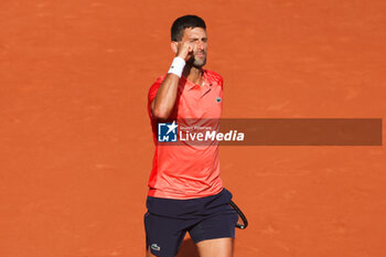 2023-06-09 - Novak Djokovic of Serbia celebrates his victory against Carlos Alcaraz of Spain during the French Open 2023, Roland-Garros 2023, Grand Slam tennis tournament, on June 9, 2023 at Stade Roland-Garros in Paris, France - TENNIS - ROLAND GARROS 2023 - WEEK 2 - INTERNATIONALS - TENNIS