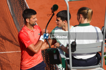 2023-06-09 - Novak Djokovic of Serbia shakes hands with Carlos Alcaraz of Spain after his victory during the French Open 2023, Roland-Garros 2023, Grand Slam tennis tournament, on June 9, 2023 at Stade Roland-Garros in Paris, France - TENNIS - ROLAND GARROS 2023 - WEEK 2 - INTERNATIONALS - TENNIS