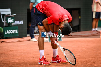 2023-06-11 - Novak DJOKOVIC of Serbia looks dejected during the fifteenth day of Roland-Garros 2023, Grand Slam tennis tournament, on June 11, 2023 at Roland-Garros stadium in Paris, France - TENNIS - ROLAND GARROS 2023 - WEEK 2 - INTERNATIONALS - TENNIS