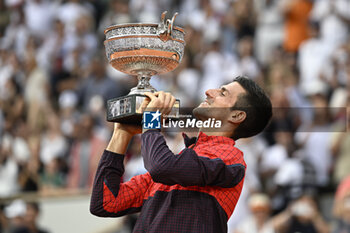 2023-06-11 - Novak Djokovic of Serbia with the trophy ("La Coupe des Mousquetaires") during the French Open final, Grand Slam tennis tournament on June 11, 2023 at Roland Garros stadium in Paris, France. Photo Victor / DPPI - TENNIS - ROLAND GARROS 2023 - WEEK 2 - INTERNATIONALS - TENNIS