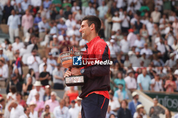 2023-06-11 - Winner Novak Djokovic of Serbia celebrates during the trophy ceremony following the Men's Singles Final between Novak Djokovic of Serbia and Casper Ruud of Norway at the French Open 2023, Roland-Garros 2023, Grand Slam tennis tournament, on June 11, 2023 at Stade Roland-Garros in Paris, France - TENNIS - ROLAND GARROS 2023 - WEEK 2 - INTERNATIONALS - TENNIS