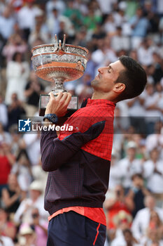 2023-06-11 - Winner Novak Djokovic of Serbia celebrates during the trophy ceremony following the Men's Singles Final between Novak Djokovic of Serbia and Casper Ruud of Norway at the French Open 2023, Roland-Garros 2023, Grand Slam tennis tournament, on June 11, 2023 at Stade Roland-Garros in Paris, France - TENNIS - ROLAND GARROS 2023 - WEEK 2 - INTERNATIONALS - TENNIS