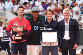 2023-06-11 - Winner Novak Djokovic of Serbia, Trophy presenter Yannick Noah, Finalist Casper Ruud of Norway, President of French Tennis Federation FFT Gilles Moretton during the trophy ceremony following the Men's Singles Final at the French Open 2023, Roland-Garros 2023, Grand Slam tennis tournament, on June 11, 2023 at Stade Roland-Garros in Paris, France - TENNIS - ROLAND GARROS 2023 - WEEK 2 - INTERNATIONALS - TENNIS