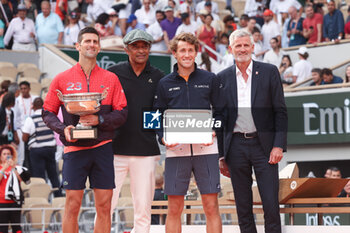 2023-06-11 - Winner Novak Djokovic of Serbia, Trophy presenter Yannick Noah, Finalist Casper Ruud of Norway, President of French Tennis Federation FFT Gilles Moretton during the trophy ceremony following the Men's Singles Final at the French Open 2023, Roland-Garros 2023, Grand Slam tennis tournament, on June 11, 2023 at Stade Roland-Garros in Paris, France - TENNIS - ROLAND GARROS 2023 - WEEK 2 - INTERNATIONALS - TENNIS