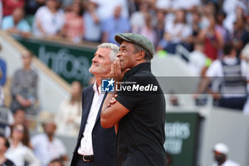 2023-06-11 - Trophy presenter Yannick Noah, President of French Tennis Federation FFT Gilles Moretton (left) during the trophy ceremony following the Men's Singles Final at the French Open 2023, Roland-Garros 2023, Grand Slam tennis tournament, on June 11, 2023 at Stade Roland-Garros in Paris, France - TENNIS - ROLAND GARROS 2023 - WEEK 2 - INTERNATIONALS - TENNIS
