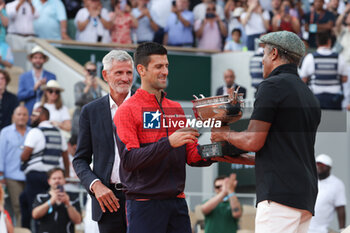 2023-06-11 - Winner Novak Djokovic of Serbia, Trophy presenter Yannick Noah, President of French Tennis Federation FFT Gilles Moretton (left) during the trophy ceremony following the Men's Singles Final at the French Open 2023, Roland-Garros 2023, Grand Slam tennis tournament, on June 11, 2023 at Stade Roland-Garros in Paris, France - TENNIS - ROLAND GARROS 2023 - WEEK 2 - INTERNATIONALS - TENNIS