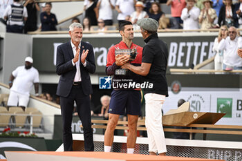 2023-06-11 - Gilles Moretton Novak Djokovic during the French Open final, Grand Slam tennis tournament on June 11, 2023 at Roland Garros stadium in Paris, France. Photo Victor Joly / DPPI - TENNIS - ROLAND GARROS 2023 - WEEK 2 - INTERNATIONALS - TENNIS