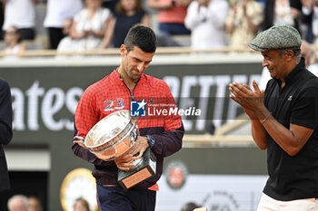 2023-06-11 - Novak Djokovic and Yannick Noah during the French Open final, Grand Slam tennis tournament on June 11, 2023 at Roland Garros stadium in Paris, France. Photo Victor Joly / DPPI - TENNIS - ROLAND GARROS 2023 - WEEK 2 - INTERNATIONALS - TENNIS