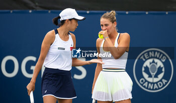 2023-08-07 - Shuai Zhang of China & Marta Kostyuk of Ukraine in action during the first round of doubles at the 2023 Omnium Banque Nationale, WTA 1000 tennis tournament on August 7, 2023 in Montreal, Canada - TENNIS - WTA - OMNIUM BANQUE NATIONALE 2023 - INTERNATIONALS - TENNIS