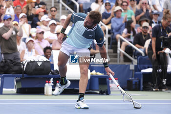 2023-08-29 - Corentin Moutet of France breaks his racquet during day 2 of the 2023 US Open Tennis Championships, Grand Slam tennis tournament on August 29, 2023 at USTA Billie Jean King National Tennis Center in New York, United States - TENNIS - US OPEN 2023 - INTERNATIONALS - TENNIS