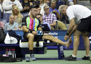 2023-08-29 - Dominik Koepfer of Germany is treated on-court for an injury during day 2 of the 2023 US Open Tennis Championships, Grand Slam tennis tournament on August 29, 2023 at USTA Billie Jean King National Tennis Center in New York, United States - TENNIS - US OPEN 2023 - INTERNATIONALS - TENNIS