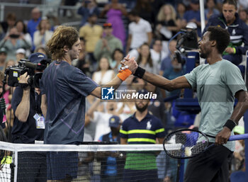 2023-08-31 - Winner Andrey Rublev of Russia shakes hands with Gael Monfils of France during day 4 of the 2023 US Open Tennis Championships, Grand Slam tennis tournament on August 31, 2023 at USTA Billie Jean King National Tennis Center in New York, United States - TENNIS - US OPEN 2023 - INTERNATIONALS - TENNIS
