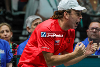 2023-09-12 - Nicolas Massu head coach of Chile celebrates after winning the point during Davis Cup 2023 Group A in Bologna 12/09/23 at the Unipol Arena - DAVIS CUP - SWEDEN VS CHILE - INTERNATIONALS - TENNIS