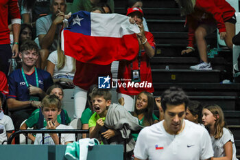 2023-09-12 - Supporters of Chile celebrates after winning the point during Davis Cup 2023 Group A match between Leo Borg (SWE) in Bologna 12/09/23 at the Unipol Arena - DAVIS CUP - SWEDEN VS CHILE - INTERNATIONALS - TENNIS