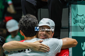 2023-09-12 - Cristian Garin (CHI) and Nicolas Massu (CHI) celebrates after winning the match during Davis Cup 2023 Group A in Bologna 12/09/23 at the Unipol Arena - DAVIS CUP - SWEDEN VS CHILE - INTERNATIONALS - TENNIS