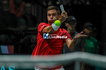 2023-09-13 - Alexis Galarneau (CAN) hits the ball with his forehand during Davis Cup 2023 Group A match between Lorenzo Sonego (ITA) at the Unipol Arena in Bologna on 13/09/23 - DAVIS CUP - CANADA VS ITALY - INTERNATIONALS - TENNIS