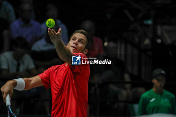 2023-09-13 - Alexis Galarneau (CAN) serving ball during Davis Cup 2023 Group A match between Lorenzo Sonego (ITA) at the Unipol Arena in Bologna on 13/09/23 - DAVIS CUP - CANADA VS ITALY - INTERNATIONALS - TENNIS