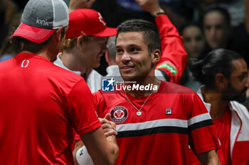 2023-09-13 - Canada National team and Alexis Galarneau (CAN) celebrates after winning the match at Davis Cup 2023 Group A match between at the Unipol Arena in Bologna on 13/09/23 - DAVIS CUP - CANADA VS ITALY - INTERNATIONALS - TENNIS