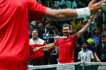 2023-09-13 - Canada captain Frank Dancevic celebrates after winning the point during Davis Cup 2023 Group A match between Lorenzo Musetti (ITA) and Gabriel Diallo (CAN) at the Unipol Arena in Bologna on 13/09/23 - DAVIS CUP - CANADA VS ITALY - INTERNATIONALS - TENNIS