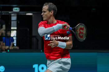 2023-09-14 - Vasek Pospisil (CAN) hits the ball with his forehand during Davis Cup 2023 Group A match between Leo Borg (SWE) at the Unipol Arena in Bologna on 14/09/23 - DAVIS CUP - CANADA VS SWEDEN - INTERNATIONALS - TENNIS
