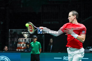 2023-09-14 - Vasek Pospisil (CAN)hits the ball with his forehand during Davis Cup 2023 Group A match between at the Unipol Arena in Bologna on 14/09/23 - DAVIS CUP - CANADA VS SWEDEN - INTERNATIONALS - TENNIS