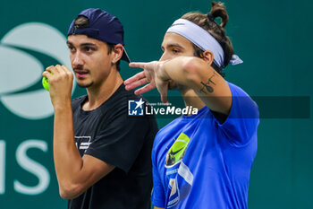 2023-09-15 - Lorenzo Musetti (ITA) and Lorenzo Sonego (ITA) talk about during training session Davis Cup 2023 Group A match between Chile at the Unipol Arena in Bologna on 14/09/23 - 2023 DAVIS CUP - ITALY VS CHILE - INTERNATIONALS - TENNIS