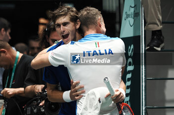 2023-09-15 - Matteo Arnaldi jubilates with te head coach Filippo Volandri at the end of the Davis Cup finals group stage match Italy vs Chile at Unipol arena, Matteo Arnaldi Vs Cristian Garin - Arnaldi won 2-6 6-4 6-3 - Bologna, Italy September 15, 2023 - ph c.b. - 2023 DAVIS CUP - ITALY VS CHILE - INTERNATIONALS - TENNIS