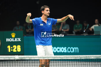 2023-09-17 - Lorenzo Sonego jubilates for the victory at the end of Italy vs Sweden - Finals group A match Lorenzo Sonego (ITA) vs Elias Ymer (SWE) at Unipol Arena - sport, tennis - September 17, 2023, Bologna, Italy - photo. c.b. - 2023 DAVIS CUP - ITALY VS SWEDEN - INTERNATIONALS - TENNIS