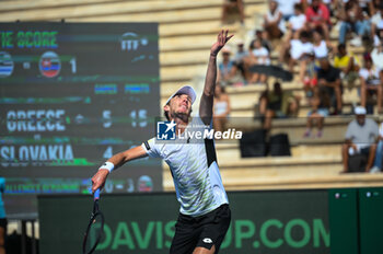 2023-09-16 - Lukas Klein of Slovakia plays in his singles match against Stefanos Tsitsipas of Greece during day one of the Davis Cup World Group I, 1st Round game between Greece and Slovakia at Panathenaic Stadium on September 16, 2023, in Athens, Greece. - WORLD GROUP I 1ST ROUND GREECE-SLOVAKIA MATCH 2 STEFANOS TSITSIPAS VS LUKAS KLEIN - INTERNATIONALS - TENNIS