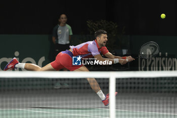 2023-10-31 - Novak Djokovic of Serbia playing doubles during day 2 of the Rolex Paris Masters 2023, ATP Masters 1000 tennis tournament on October 31, 2023 at Accor Arena in Paris, France - TENNIS - ATP - ROLEX PARIS MASTERS 2023 - INTERNATIONALS - TENNIS