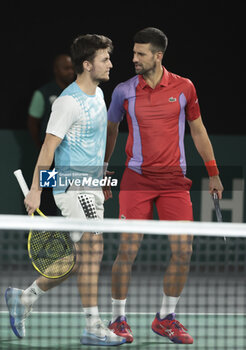 2023-10-31 - Miomir Kecmanovic and Novak Djokovic of Serbia playing doubles during day 2 of the Rolex Paris Masters 2023, ATP Masters 1000 tennis tournament on October 31, 2023 at Accor Arena in Paris, France - TENNIS - ATP - ROLEX PARIS MASTERS 2023 - INTERNATIONALS - TENNIS
