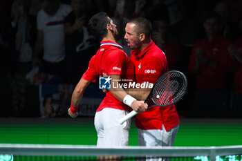 2023-11-23 - Novak Djokovic and Viktor Troicki
during the
Finals Davis Cup 2023 match 
Serbia vs Great Britain at 
the Palacio Martin Carpena, Spain in Malaga on 
November 23, 2023 - 2023 DAVIS CUP FINALS - INTERNATIONALS - TENNIS