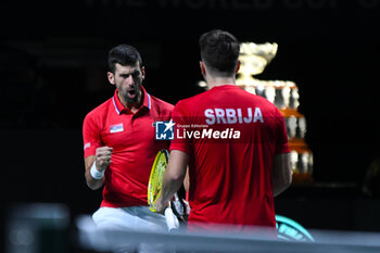 2023-11-25 - Miomir Kecmanovic and Novak Djokovic
during the
Finals Davis Cup 2023 match 
Italy vs Serbia
the Palacio Martin Carpena, Spain in Malaga on 
November 25, 2023 - DAVIS CUP - INTERNATIONALS - TENNIS
