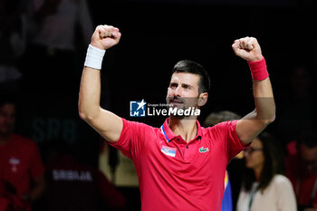 2023-11-23 - Novak Djokovic of Serbia celebrates after winning in match 2 during the Davis Cup Finals 2023, Quarter-finals tennis match between Serbia and Great Britain on November 23, 2023 at Martin Carpena Pavilion in Malaga, Spain - TENNIS - DAVIS CUP FINALS 2023 - 1/4 - SERBIA V GREAT BRITAIN - INTERNATIONALS - TENNIS