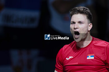 2023-11-23 - Miomir Kecmanovic of Serbia celebrates after winning in match 1 during the Davis Cup Finals 2023, Quarter-finals tennis match between Serbia and Great Britain on November 23, 2023 at Martin Carpena Pavilion in Malaga, Spain - TENNIS - DAVIS CUP FINALS 2023 - 1/4 - SERBIA V GREAT BRITAIN - INTERNATIONALS - TENNIS