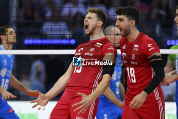 2023-09-14 - Jakub Kochanowski (POL) and Marcin Janusz (POL) and during the CEV Eurovolley 2023 semifinal match between Slovenia vs Poland, Palazzo dello Sport in Rome, Italy, on September 14, 2023. - SEMIFINAL - POLAND VS SLOVENIA - CEV EUROVOLLEY MEN - VOLLEYBALL