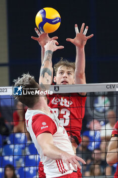 2023-09-10 - Poland's Tomasz Fornal vies in action against Belgium's Ferre Reggers - EIGHT FINAL - POLAND VS BELGIUM - CEV EUROVOLLEY MEN - VOLLEYBALL