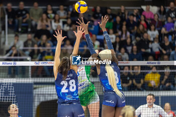2023-11-19 - Attack of Silvia Bussoli (Wash4green Pinerolo) over the block of Paola Egonu and Sonia Candi (Allianz VV Milano) - ALLIANZ VV MILANO VS WASH4GREEN PINEROLO - SERIE A1 WOMEN - VOLLEYBALL