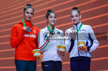 2024-05-26 - (L-R) Podium Finals Ball Senior with Fanni Pigniczki (HUN) silver medal, Sofia Raffaeli (ITA) gold medal and Daniela Munits (ISR) bronze medal during 40th European Rhythmic Gymnastics Championships Budapest 2024 at Papp Laszlo Budapest Sportarena, Budapest, Hungary on May 26, 2024 - 40TH EUROPEAN RHYTHMIC CHAMPIONSHIPS SENIOR INDIVIDUALS & GROUPS AND JUNIOR INDIVIDUALS - GYMNASTICS - OTHER SPORTS