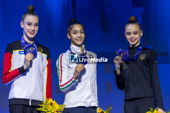 2024-06-23 - Podium Individual Finals Ribbon of FIG Rhythmic Gymnastics World Cup, at Unipol Forum, Milan on 23 June, 2024 - RHYTHMIC GYMNASTIC - WORLD CUP 2024 FINALS - GYMNASTICS - OTHER SPORTS