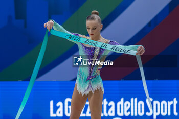 2024-06-23 - VEDENEEVA Ekaterina (Slo) during Finals Ribbon of FIG Rhythmic Gymnastics World Cup, at Unipol Forum, Milan on 23 June, 2024 - RHYTHMIC GYMNASTIC - WORLD CUP 2024 FINALS - GYMNASTICS - OTHER SPORTS