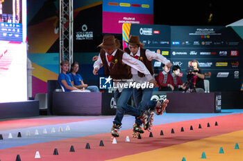 11/09/2024 - The Chinese couple, Li Ran and Sun Xin Zhao, third place in the final of the Inline Freestyle Pair Slalom specialty, during the 