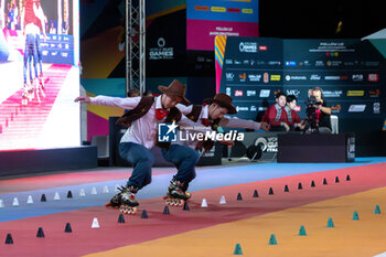 11/09/2024 - The Chinese couple, Li Ran and Sun Xin Zhao, third place in the final of the Inline Freestyle Pair Slalom specialty, during the 